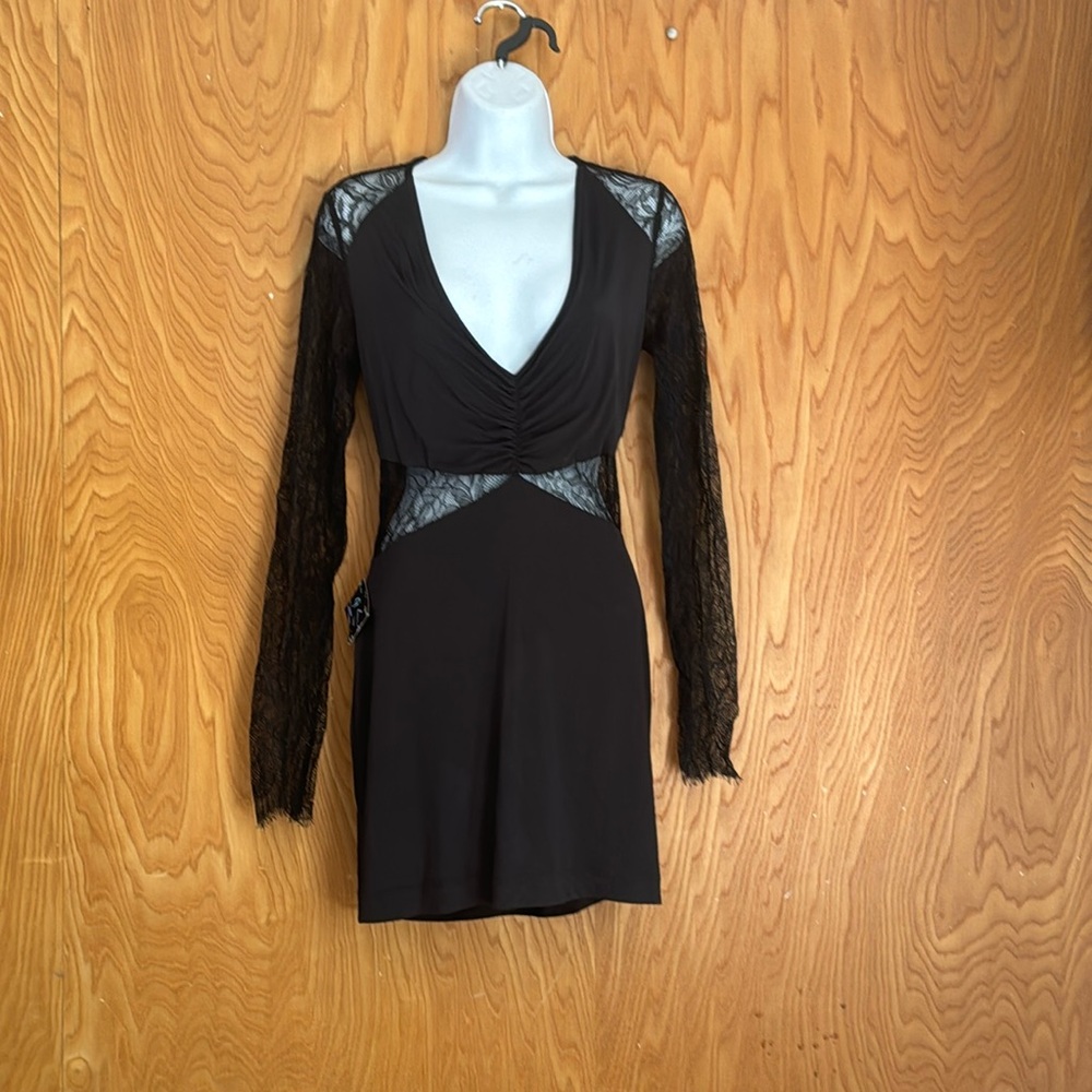 Nast Gal black dress. Drop V-neck. Long lace sleeve. Above the knee. Date night